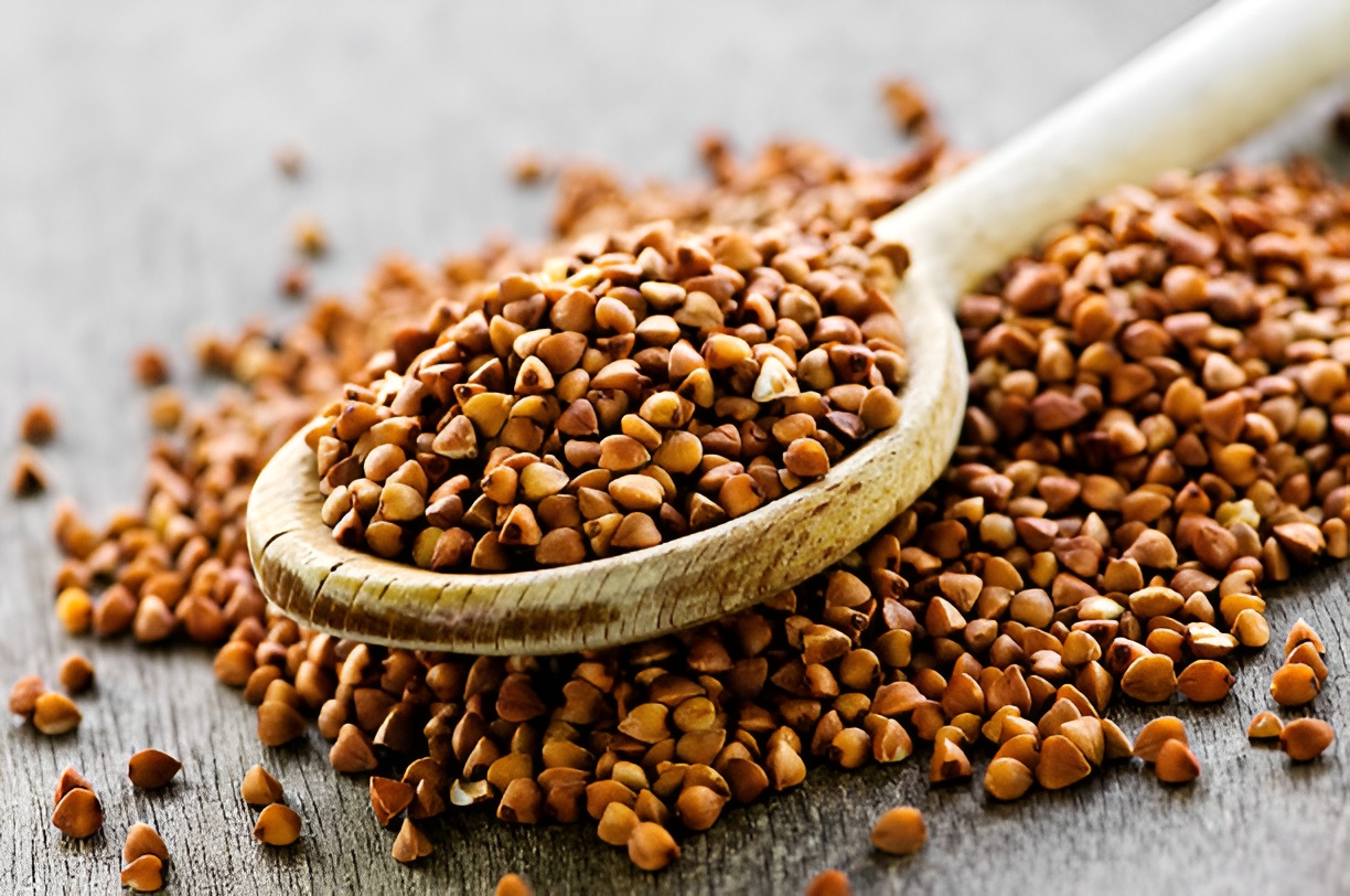 buckwheat seeds on a wooden spoon